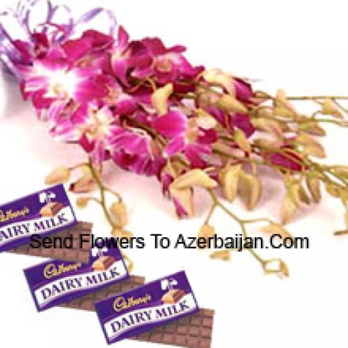 Carini orchidee rosa con cioccolatini Cadbury