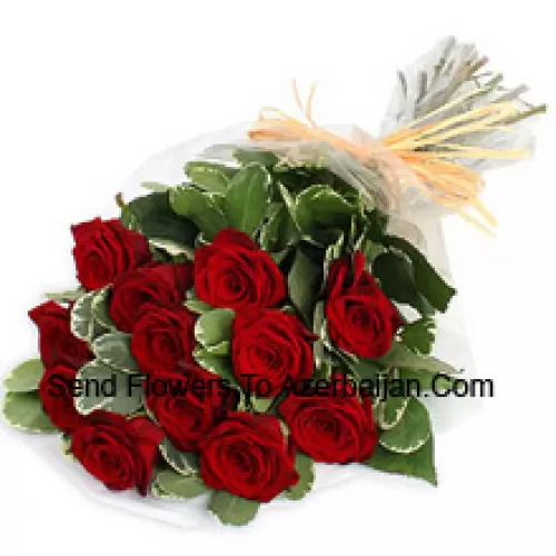 Un magnifique bouquet de 11 roses rouges avec des remplisseurs saisonniers