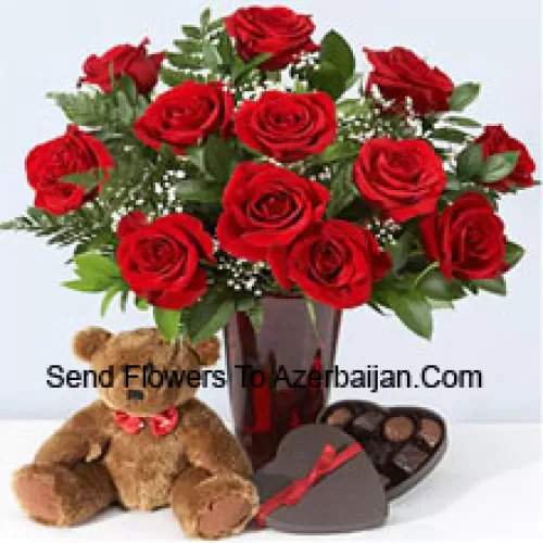 11 Red Roses With Some Ferns In A Vase, Cute Brown 10 Inches Teddy Bear And A Heart Shaped Chocolate Box.